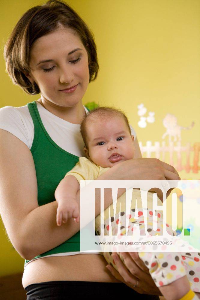 Mother with a baby at home. 12670807