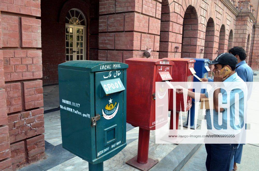 (151009) -- LAHORE, Oct. 9, 2015 -- Pakistani people post letters in a mailbox on the World Post Day in eastern Pakistan s Lahore, Oct. 9, 2015. World Post Day is celebrated each year on Oct. 9, the anniversary of the establishment of the Universal Postal Union (UPU) in 1874 in Berne, the Swiss capital. ) PAKISTAN-LAHORE-WORLD POST DAY JamilxAhmed