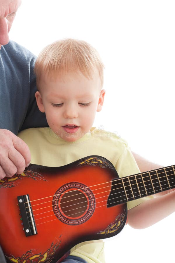 Grandfather teaching grandson play on guitar, Grandfather teaching grandson play on acoustic guitar. Over white background