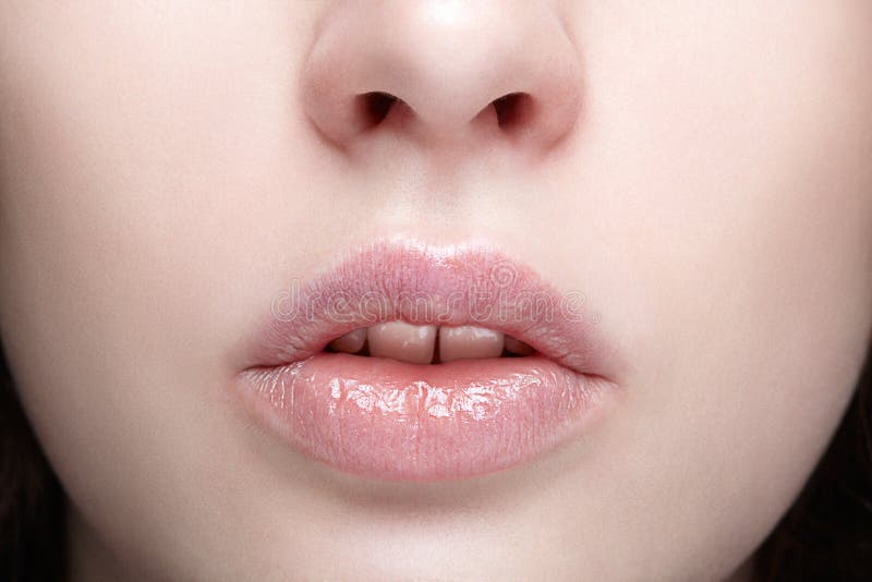 Closeup macro portrait of female part of face. Human woman lips, Closeup macro portrait of female part of face. Human woman lips with day beauty makeup. Girl with perfect lips shape. model released