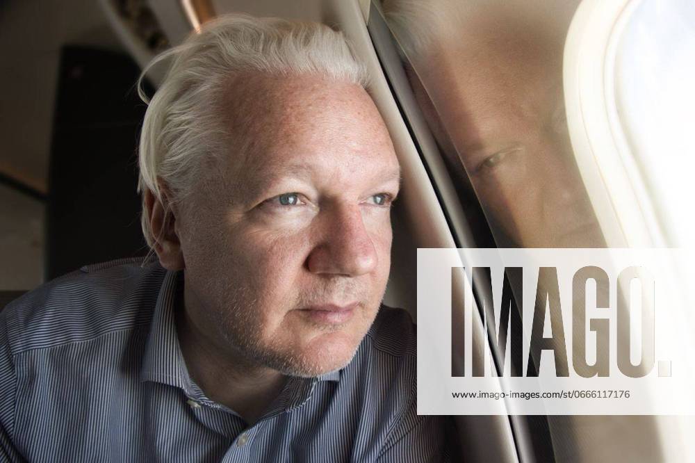 JULIAN ASSANGE RELEASE, A supplied image shows Wikileaks founder Julian Assange peering out the window of a plane as it approaches Bangkok Airport following his release from prison in the United Kingdom, Tuesday, June 25, 2024. Assange is expected to appear before a U.S Court in the Northern Mariana Islands tomorrow morning before his expected return to Australia. ( NO ARCHIVING, , NO USE IN BOOKS WITHOUT CONSENT AUSTRALIA