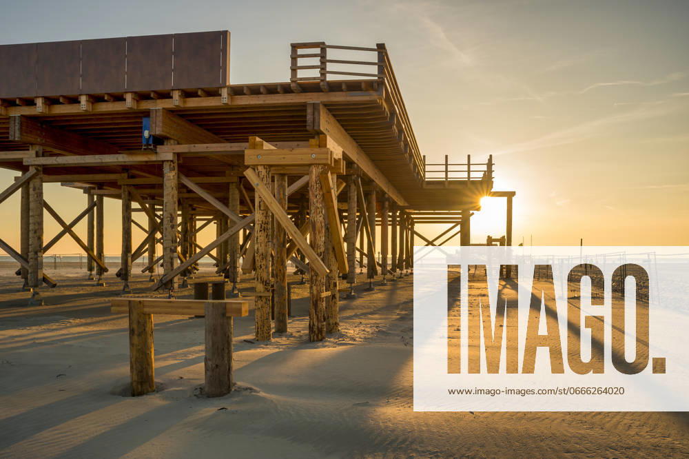 Germany, Schleswig-Holstein, St. Peter-Ording, Empty pier at sunset, FRF01036