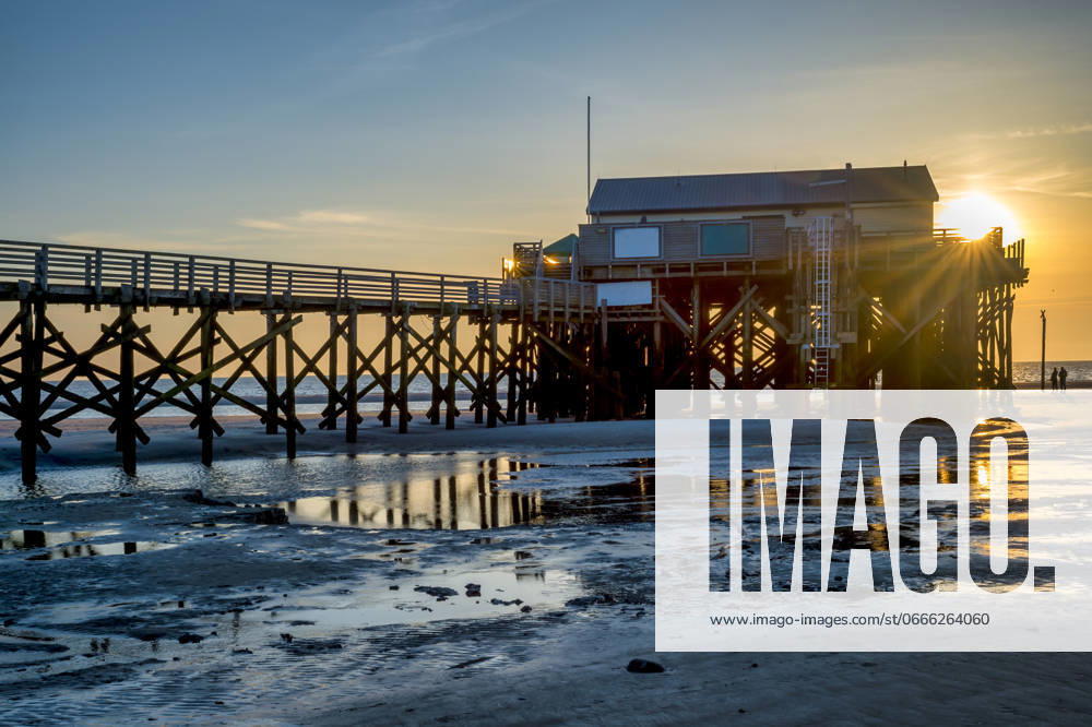 Germany, Schleswig-Holstein, St. Peter-Ording, Empty pier at sunset, FRF01039