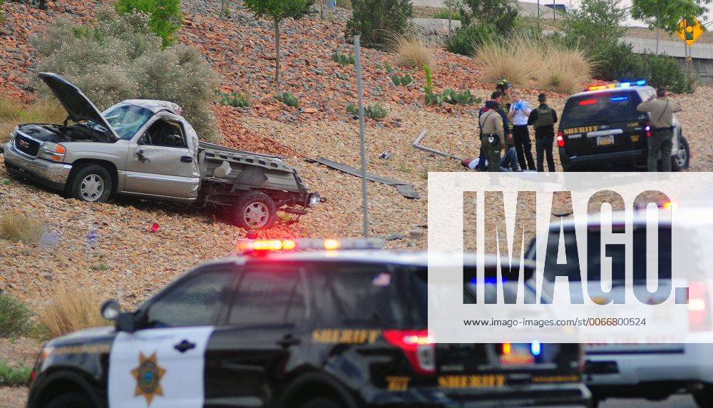 Albuquerque, NEW MEXICO, U.S. - 042714 .Bernalillo Sheriff Deputies take one of the stolen car suspects involved in a crash on Locust near Central N.E. into custody after a chase that started in the South Valley on Sunday April 27, 2014. ADOLPHE PIERRE-LOUIS JOURNAL - ZUMAab1