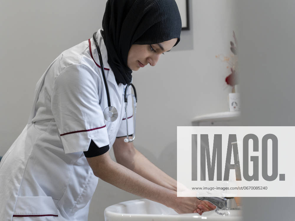 Doctor washing hands in sink model released