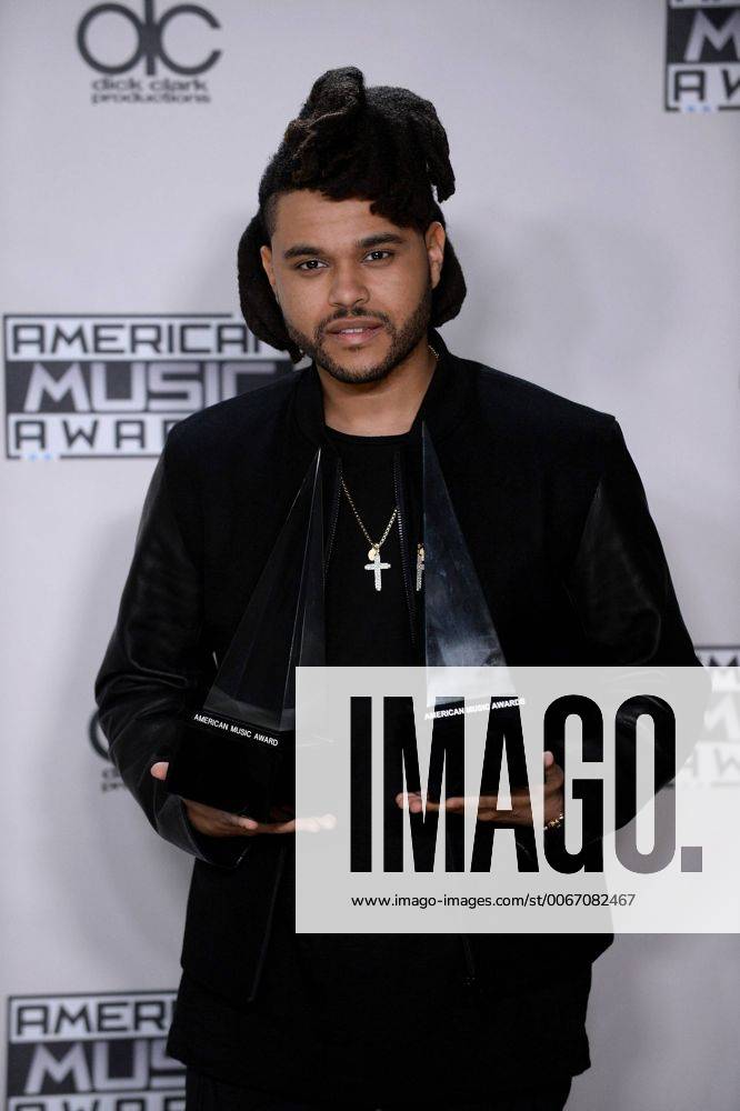 Recording artist The Weeknd, winner of Favorite Soul R&B Male Artist and Favorite Soul R&B Album, appears backstage during the 43rd annual American Music Awards held at Microsoft Theater in Los Angeles on November 22, 2015. LAP20151122422 JIMxRUYMEN