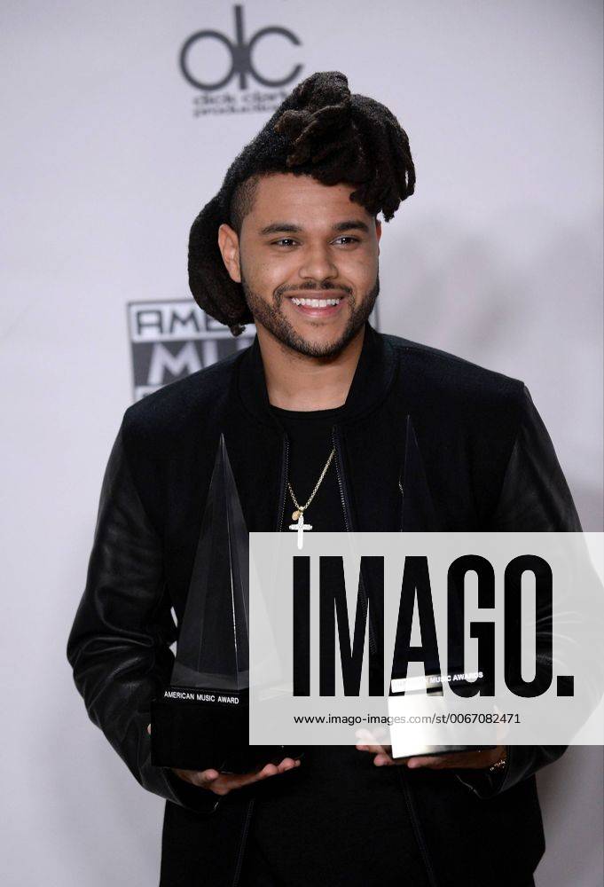 Recording artist The Weeknd, winner of Favorite Soul R&B Male Artist and Favorite Soul R&B Album, appears backstage during the 43rd annual American Music Awards held at Microsoft Theater in Los Angeles on November 22, 2015. LAP20151122424 JIMxRUYMEN