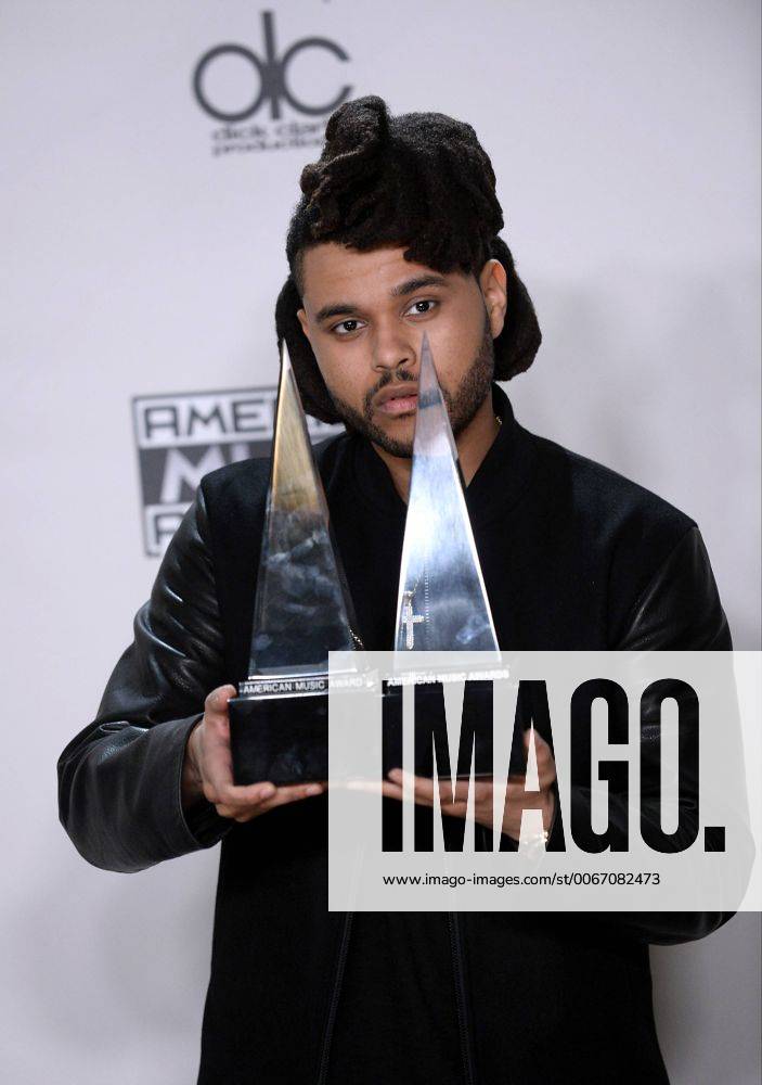 Recording artist The Weeknd, winner of Favorite Soul R&B Male Artist and Favorite Soul R&B Album, appears backstage during the 43rd annual American Music Awards held at Microsoft Theater in Los Angeles on November 22, 2015. LAP20151122425 JIMxRUYMEN