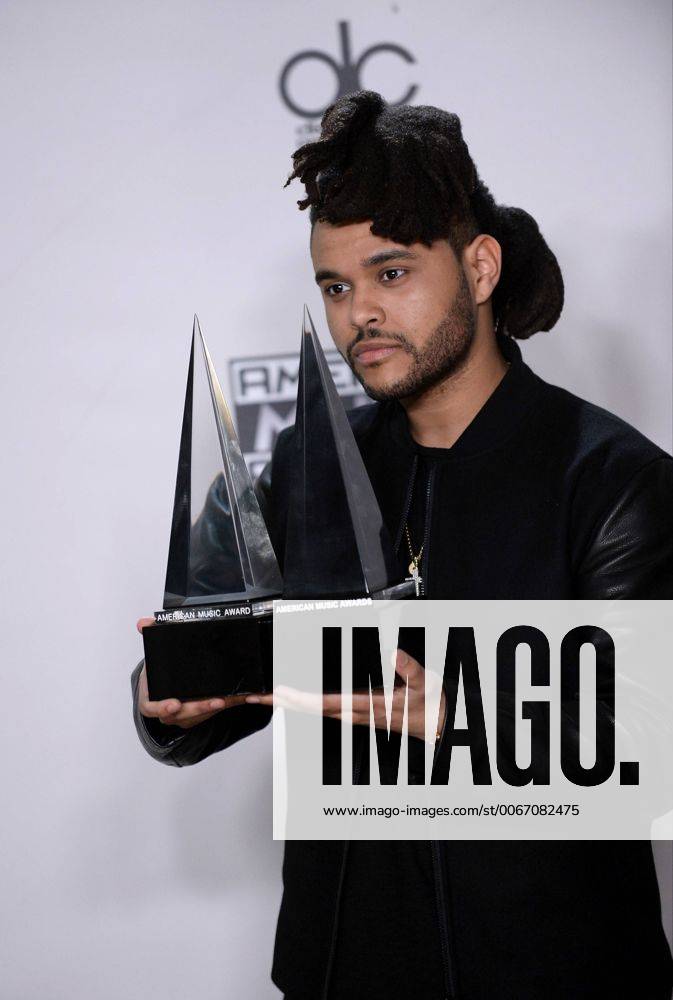 Recording artist The Weeknd, winner of Favorite Soul R&B Male Artist and Favorite Soul R&B Album, appears backstage during the 43rd annual American Music Awards held at Microsoft Theater in Los Angeles on November 22, 2015. LAP20151122426 JIMxRUYMEN