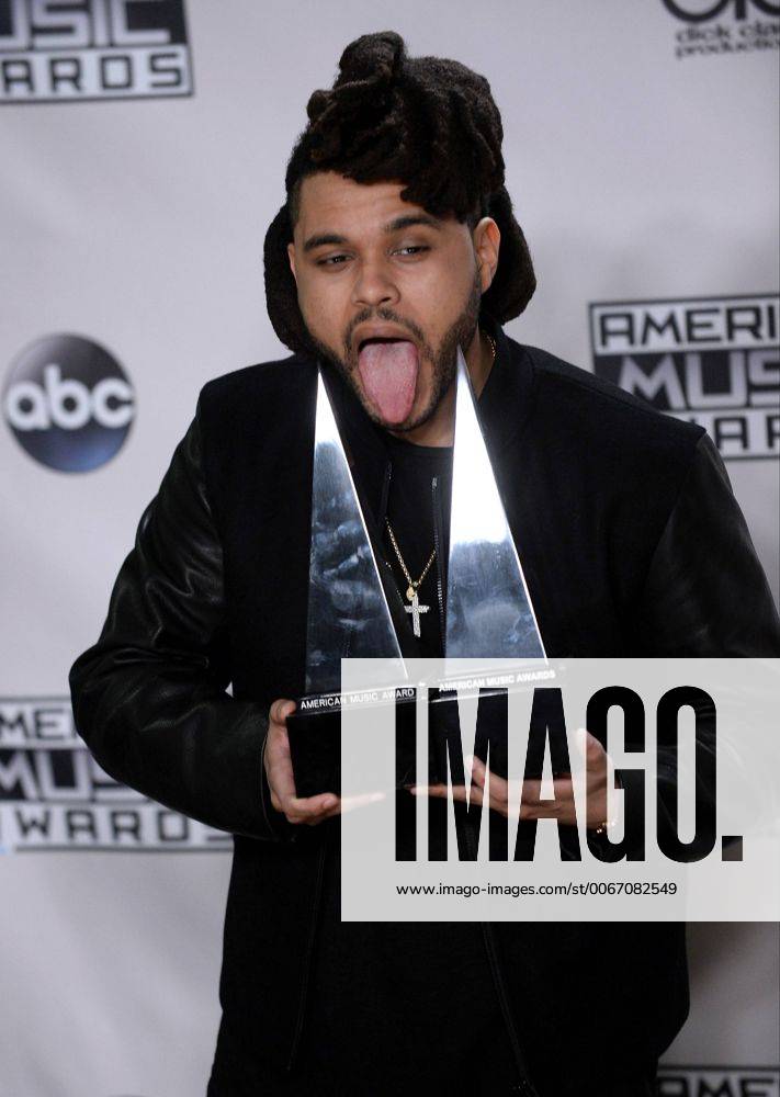 Recording artist The Weeknd, winner of Favorite Soul R&B Male Artist and Favorite Soul R&B Album, appears backstage during the 43rd annual American Music Awards held at Microsoft Theater in Los Angeles on November 22, 2015. LAP20151122429 JIMxRUYMEN
