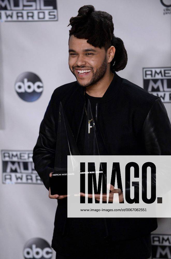 Recording artist The Weeknd, winner of Favorite Soul R&B Male Artist and Favorite Soul R&B Album, appears backstage during the 43rd annual American Music Awards held at Microsoft Theater in Los Angeles on November 22, 2015. LAP20151122430 JIMxRUYMEN
