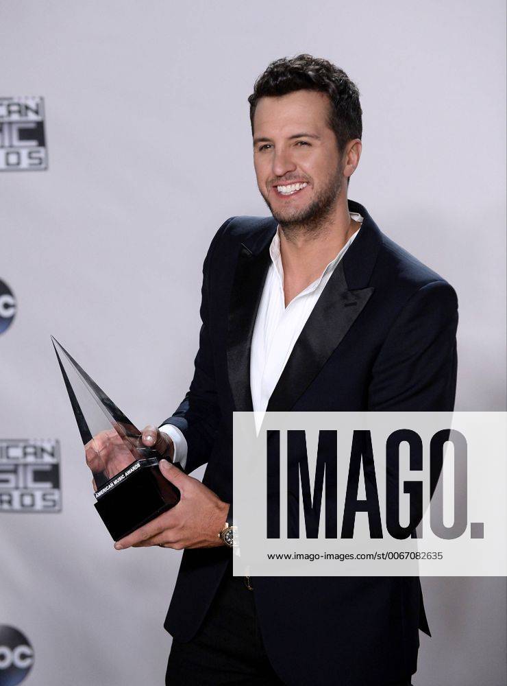 Recording artist Luke Bryan, winner of Favorite Country Male Artist, appears backstage during the 43rd annual American Music Awards held at Microsoft Theater in Los Angeles on November 22, 2015. LAP20151122419 JIMxRUYMEN