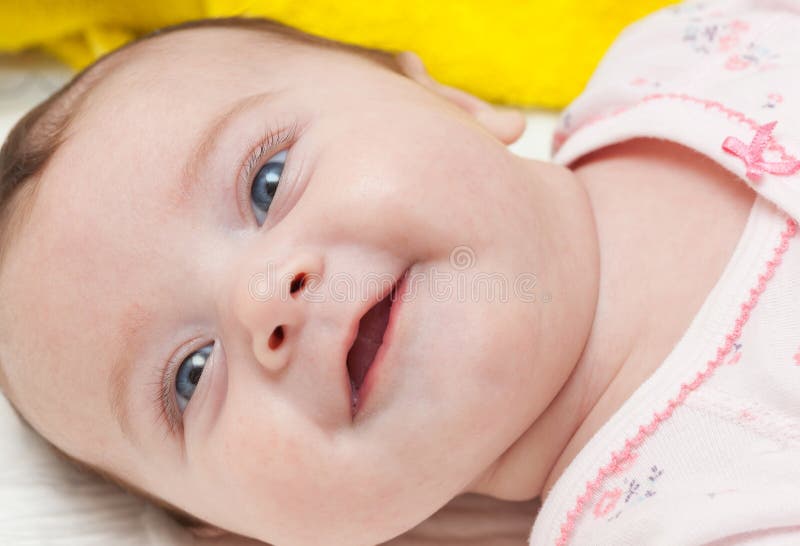 Portrait of a smiling newborn baby girl, Portrait of a smiling newborn baby girl. model released