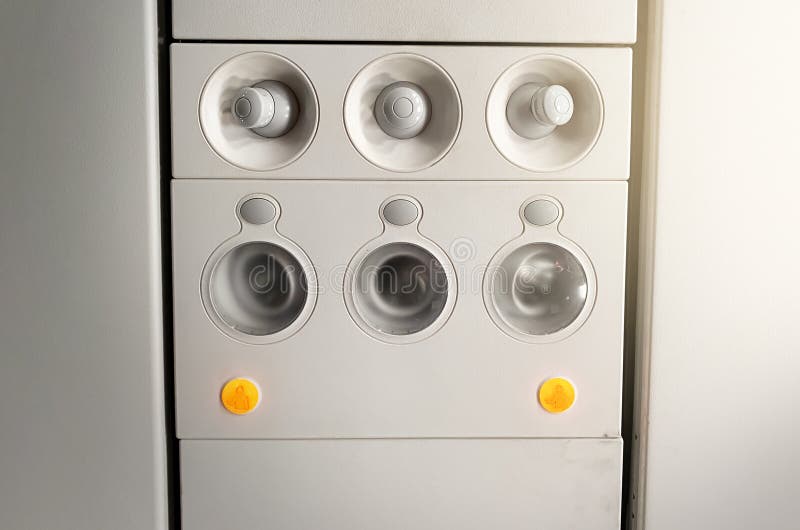 Adjustable lights and air conditioners overhead seat controls of a commercial aircraft in an airplane, Adjustable lights and air conditioners overhead seat controls of a commercial aircraft. Closed air conditioners nozzles