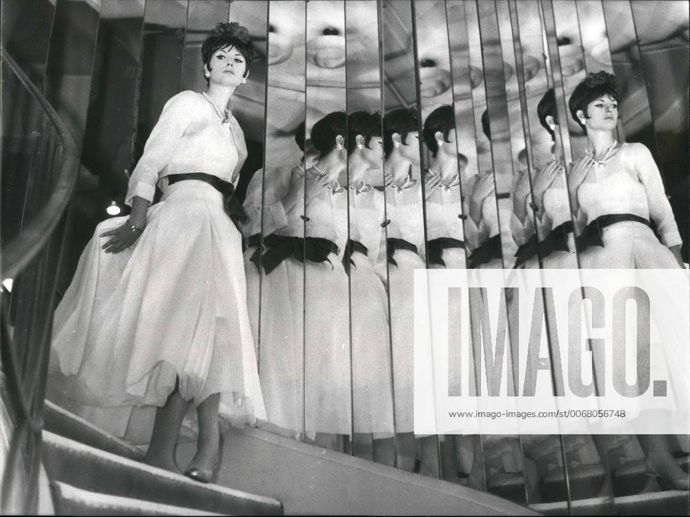 IMAGO ICONS: Coco Chanel 1963 - Great Couturiers present their spring summer fashion; A Glimpse of Coco Chanel s new 1963 line; Photo Shows Evening dress of white organdi and red belt obligatory mention creation chanel immediate diffusion. - ZUMAk09_