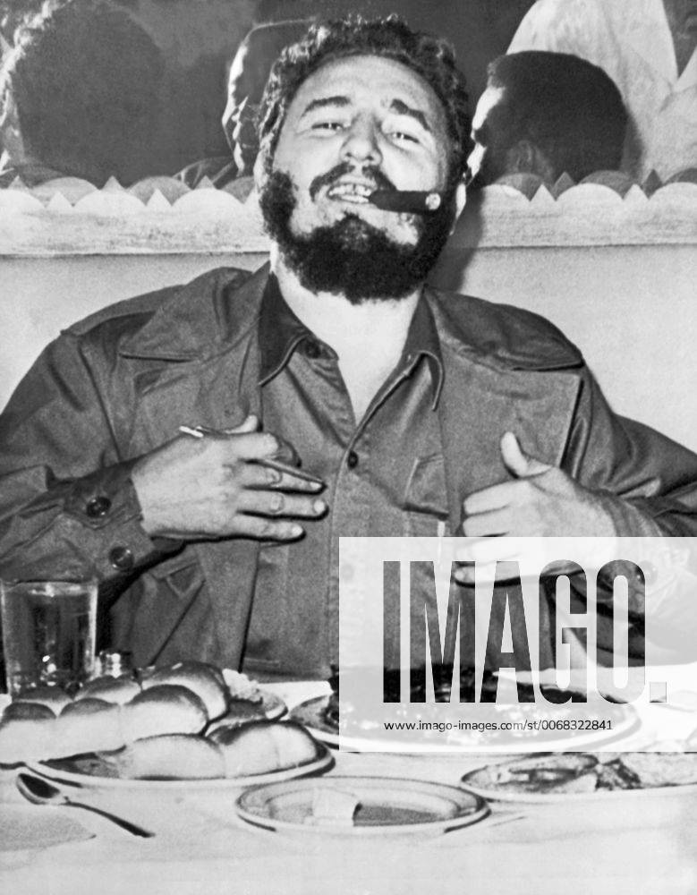 New York, New York: September 23, 1960 Cuban Prime Minister Fidel Castro enjoys a steak dinner while holding an impromptu press conference at the Theresa Hotel in Harlem during his visit to New York to address the United Nations.