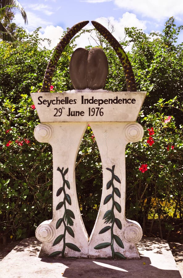 Seychelles independence monument on Praslin Island, Seychelles independence monument on Praslin Island with a Coco de Mer nut