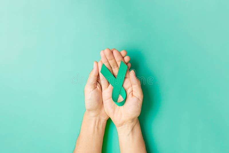 September Ovarian cancer Awareness month, Woman holding teal Ribbon color for supporting people living, and illness. Healthcare, September Ovarian cancer Awareness month, Woman holding teal Ribbon color for supporting people living, and illness. Healthcare and world cancer day concepts
