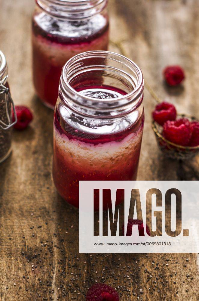 Homemade yogurt with raspberry puree and chia seeds on wood ODF001362