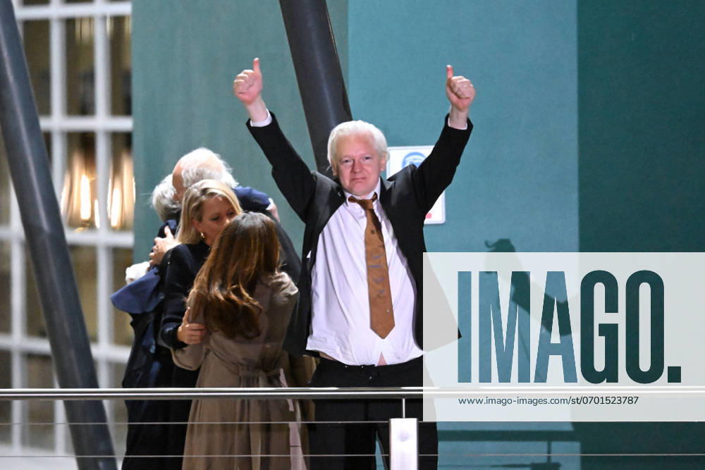JULIAN ASSANGE RELEASE AUSTRALIA, WikiLeaks founder Julian Assange waves at supporters after arriving at Canberra Airport, Canberra, Wednesday, June 26, 2024. ( NO ARCHIVING, , NO USE IN BOOKS WITHOUT CONSENT CANBERRA ACT AUSTRALIA