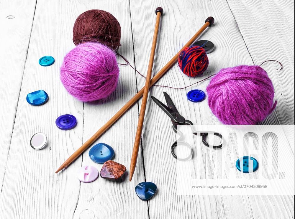 Close-up of tool knitting. banner with knitting wool and knitting needles and buttons ,model released, Symbolfoto