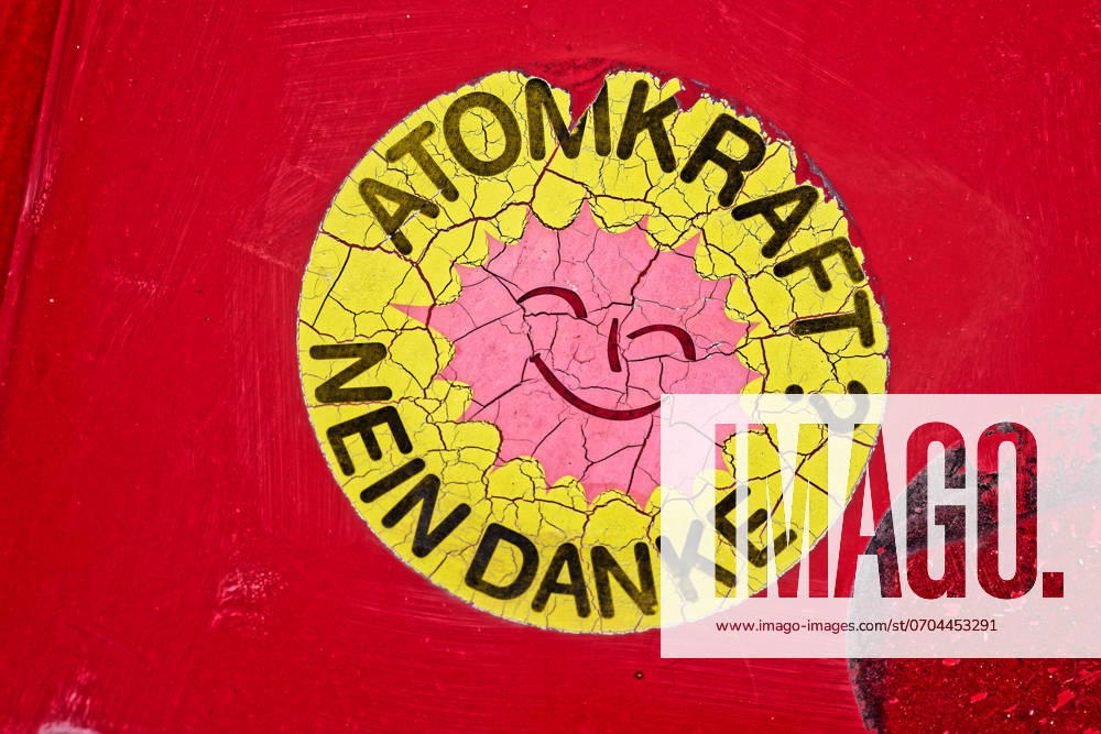An aging sticker of the anti-nuclear movement on a car Atomkraft Nein danke This sticker is now dissolving after time Traunstein Bavaria Germany