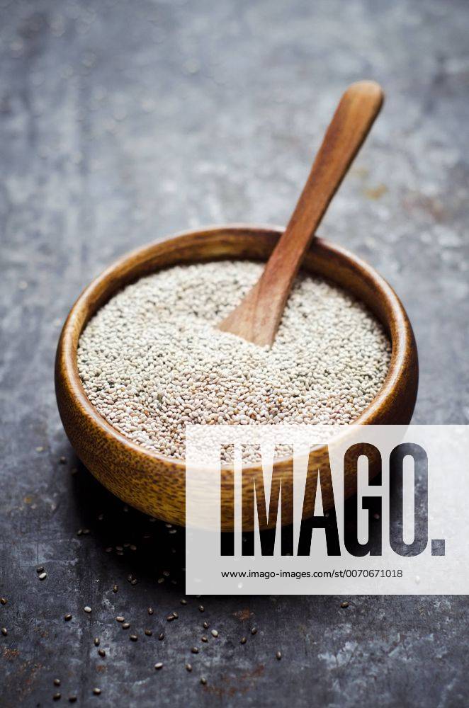 Wooden bowl of white chia seeds CZF000246