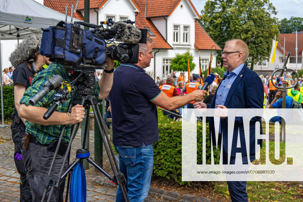 Ostercappeln, Germany 06 July 2024 On Saturday morning, around 1900 people gathered on the church square in Ostercappeln to demonstrate against the closure of the St Raphael hospital Here Ostercappeln Mayor Erik Ballmeyer in an interview Kirchplatz Niedersachsen