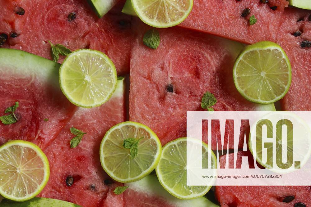 Close up of Fresh Watermelon and Lime slices garnished With Mint Leaves