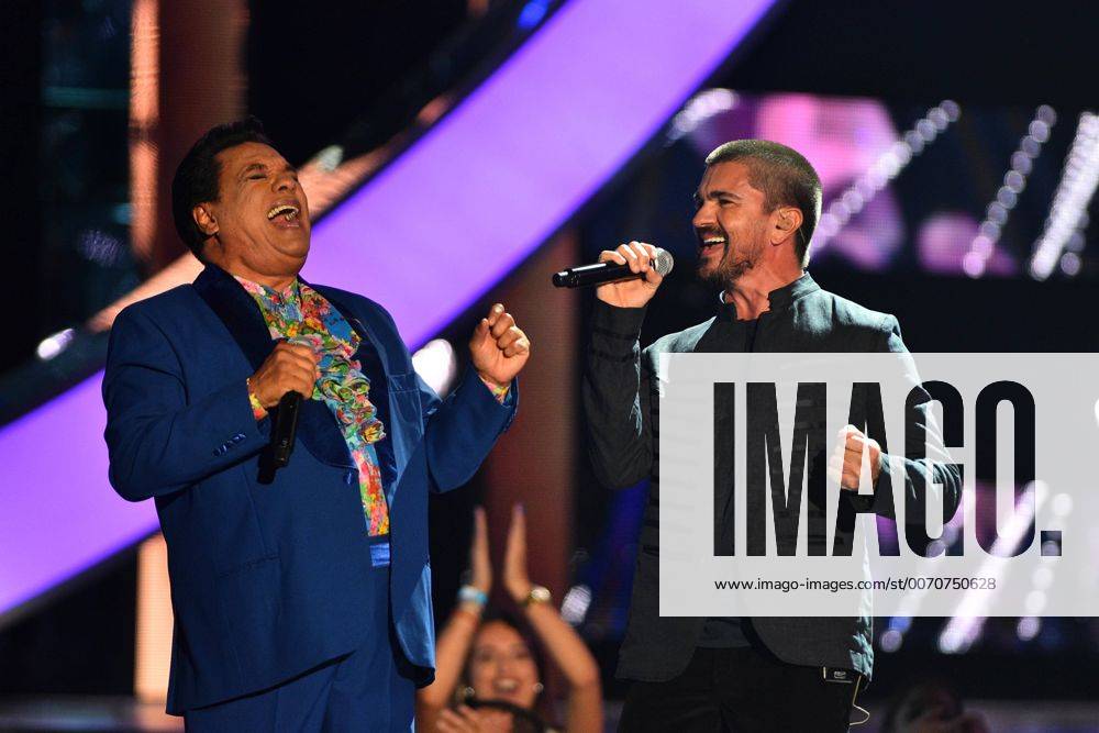 Mexican singer Juan Gabriel performs on stage with Colombian Juanes during the ceremony of the Latin Music Billboard Awards at the BankUnited Center in Coral Gables, Florida, United States, 28 April 2016. LATIN MUSIC BILLBOARD AWARDS !ACHTUNG: NUR REDAKTIONELLE NUTZUNG! CGS042 20160429-635975085675305517