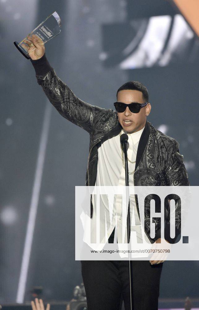 Latin artist Daddy Yankee holds the Leader in Industry award at the 2016 Billboard Latin Music Awards at the Bank United Center, University of Miami, Miami, Florida on April 28, 2016. MIA20160428121 GARYxIxROTHSTEIN
