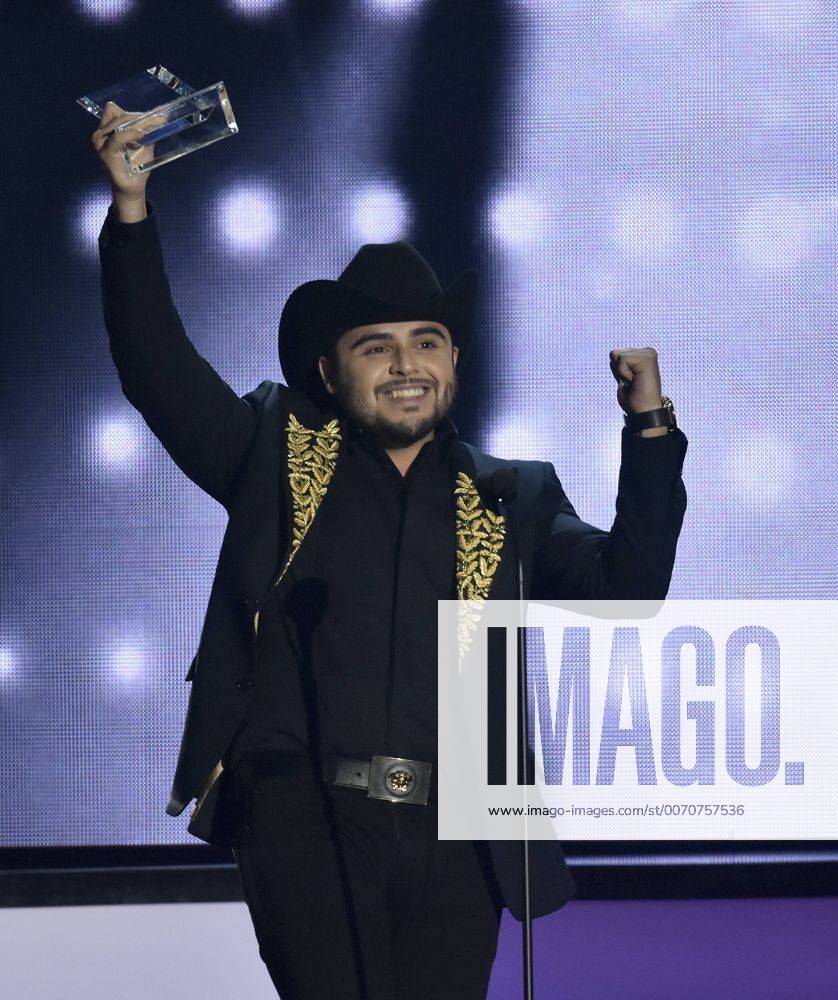 Latin artist Gerardo Ortiz holds is award at the 2016 Billboard Latin Music Awards at the Bank United Center, University of Miami, Miami, Florida on April 28, 2016. MIA20160428132 GARYxIxROTHSTEIN