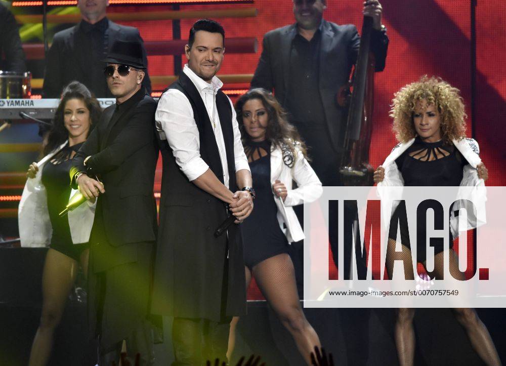 Latin artists (R-L) Victor Manuelle & Yandel perform at the 2016 Billboard Latin Music Awards at the Bank United Center, University of Miami, Miami, Florida on April 28, 2016. MIA20160428150 GARYxIxROTHSTEIN
