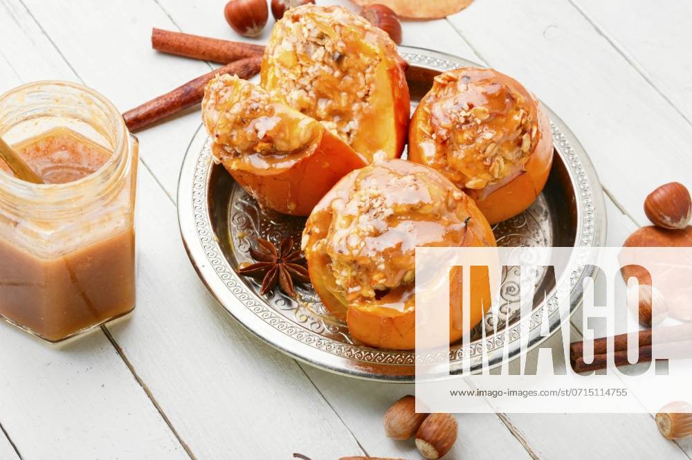 Persimmon stuffed with oatmeal with caramel sauce.Baked persimmon.Closeup photo. Baked stuffed persimmon ,model released, Symbolfoto