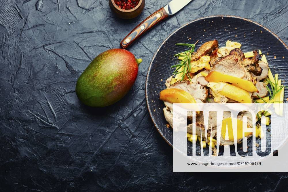 Delicious grilled meat with mango and cheese.. Fried pork with mango and cheese. ,model released, Symbolfoto