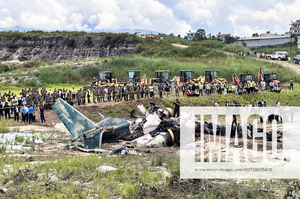 Rescuers work at the plane crash site near the Tribhuvan International Airport in Kathmandu, Nepal, on July 24, 2024. At least 18 people were killed and 1 injured after a passenger plane of Saurya Airlines aircraft heading from Kathmandu to Pokhara crashed during take off near the Nepal s Tribhuvan International Airport (TIA) on Wednesday morning , authorities confirmed. - ZUMAs233 20240724_zap_s233_012