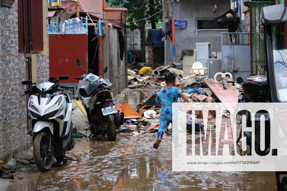 On July 25, 2024, residents of Marikina, Philippines, clean their homes, salvage products and personal belongings ruin by dirt and mud after heavy rain and flooding from Typhoon Gaemi, locally named Carina.