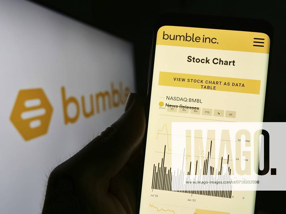 Stuttgart, Germany, 06-28-2023: Person holding cellphone with website of US online dating company Bumble Inc. on screen in front of logo. Focus on center of phone display, Europe
