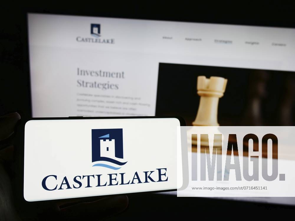 Stuttgart, Germany, 11-29-2023: Person holding smartphone with logo of US investment management company Castlelake L.P. in front of website. Focus on phone display, Europe
