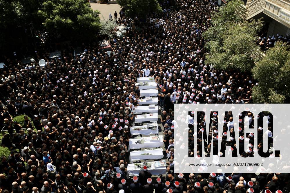 (240728) -- GOLAN HEIGHTS, July 28, 2024 -- This photo taken on July 28, 2024 shows the funeral of the people killed in a rocket attack in the Druze town Majdal Shams, in the Israeli-occupied Golan Heights. Israeli officials have called for retaliation against Hezbollah following a rocket attack on a football pitch in Majdal Shams in the Israeli-occupied Golan Heights that killed at least 12 children and youths on Saturday. The Lebanese Shiite militant group has denied involvement. (Photo by Jamal Awad Xinhua) MIDEAST-GOLAN HEIGHTS-ROCKET ATTACK ZongxHe
