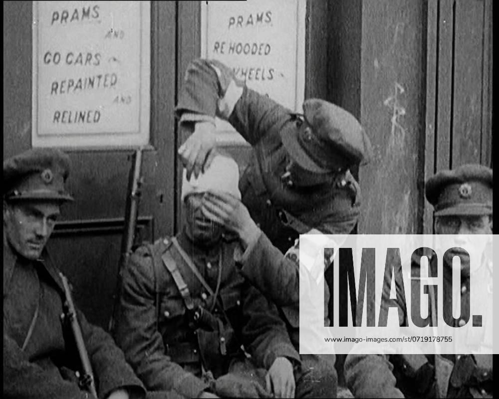 Irish Soldiers Sitting in the Street and Tending to Their Injuries from Fighting in Dublin, 1922. From Time to Remember - Sitting Still And Going Slowly, 1922 (Reel 4); a review of events in 1922 including Irish Troubles, war between Greece and Turkey and developments in aviation and radio.