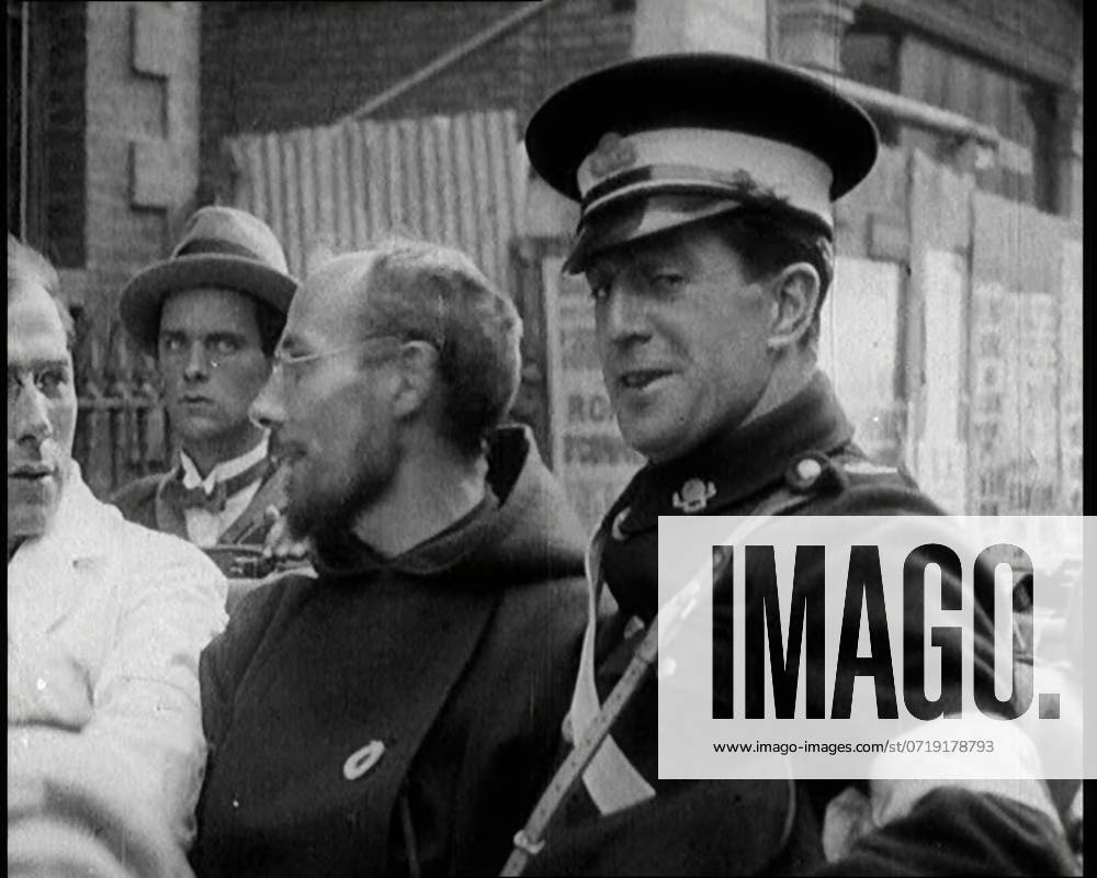 An Irish Priest Talking to a Soldier in a Car, Trying to Bring Peace, 1922. From Time to Remember - Sitting Still And Going Slowly, 1922 (Reel 4); a review of events in 1922 including Irish Troubles, war between Greece and Turkey and developments in aviation and radio.