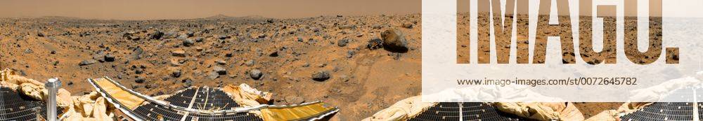 This is a geometrically improved, color enhanced version of the 360-degree panorama heretofore known as the Gallery Pan, the first contiguous, uniform panorama taken by the Imager for Mars Pathfinder (IMP) over the course of Sols 8, 9, and 10. Different regions were imaged at different times over the three Martian days to acquire consistent lighting and shadow conditions for all areas of the panorama. At left is a Lander petal and a metallic mast which is a portion of the low-gain antenna. Misregistration in the antenna and other Lander features is due to parallax in the extreme foreground. On the horizon the double Twin Peaks are visible, about 1-2 kilometers away. The rock Couch is the dark, curved rock at right of Twin Peaks. Another Lander petal is at left-center, showing the fully deployed forward ramp at far left, and rear ramp at right, which rover Sojourner us