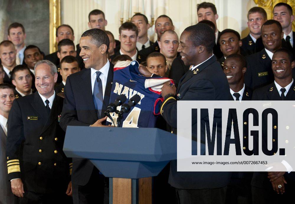 May 3,2010 - Washington, District of Columbia USA - .The Navy football team presents President Obama with a number 44 Navy football jersey during the presentation of the Commander-in-Chief s Trophy to the Naval Academy in the East Room of the White House on Monday. The Commander-in-Chief s Trophy is awarded to each season s winner of the triangular college football series among the United States Military Academy, the United States Naval Academy, and United States Air Force Academy. - ZUMAmv2_