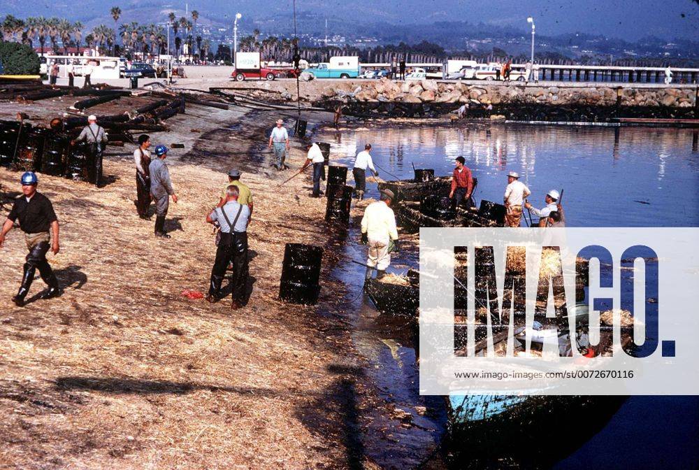 California, U.S. - Oil spill & pollution---Spreading straw on oil-covered waters in SB Harbor following spill in 1969. The Santa Barbara oil spill occurred in 1969 in the Santa Barbara Channel. The source was a January 28, 1969 blow-out on Union Oil s Platform A, six miles offshore, in the Dos Cuadras Offshore Oil Field. Over a 10-day period, an estimated 80,000 to 100,000 barrels 1 of crude oil spilled into the channel and onto the beaches of Santa Barbara County in Southern California, fouling the coastline from Goleta to the Rincon, and all four of the northern Channel Islands. Upward of 10,000 birds were killed in the ecological disaster.NEWS-PRESS FILE PHOTO - ZUMAb77_
