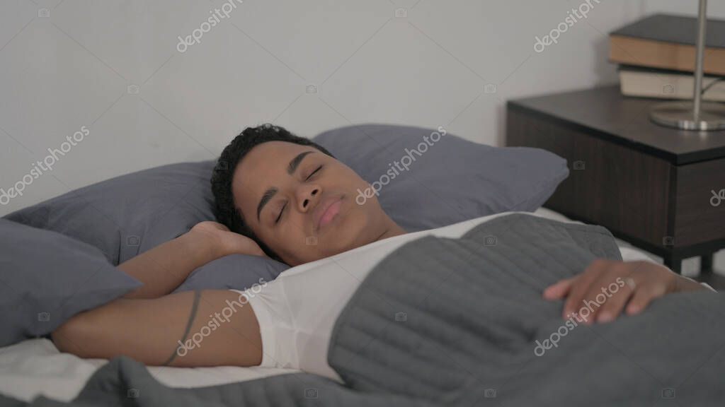 The Relaxed Young African Woman Sleeping in Bed Peacefully