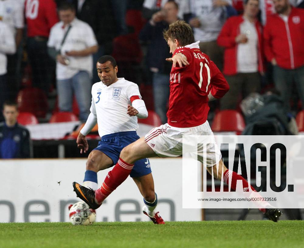 Denmarks Nicklas Bendtner (R) tussles with Englands Ashley Cole International Friendly Denmark v England 9th February, 2011 .