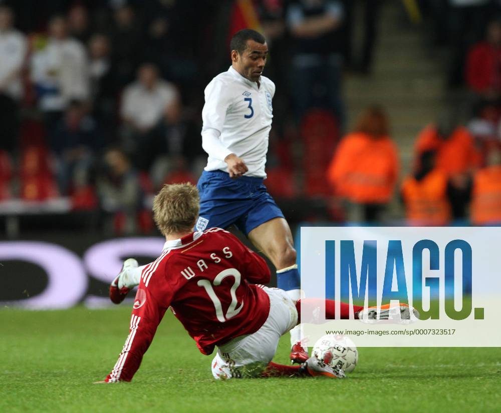 Denmarks Daniel Wass (L) tussles with Englands Ashley Cole International Friendly Denmark v England 9th February, 2011 .