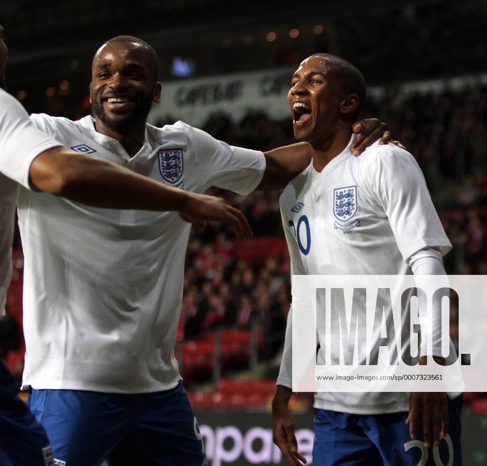 Englands Ashley Young (R) celebrates scoring his sides second goal with Darren Bent International Friendly Denmark v England 9th February, 2011 .