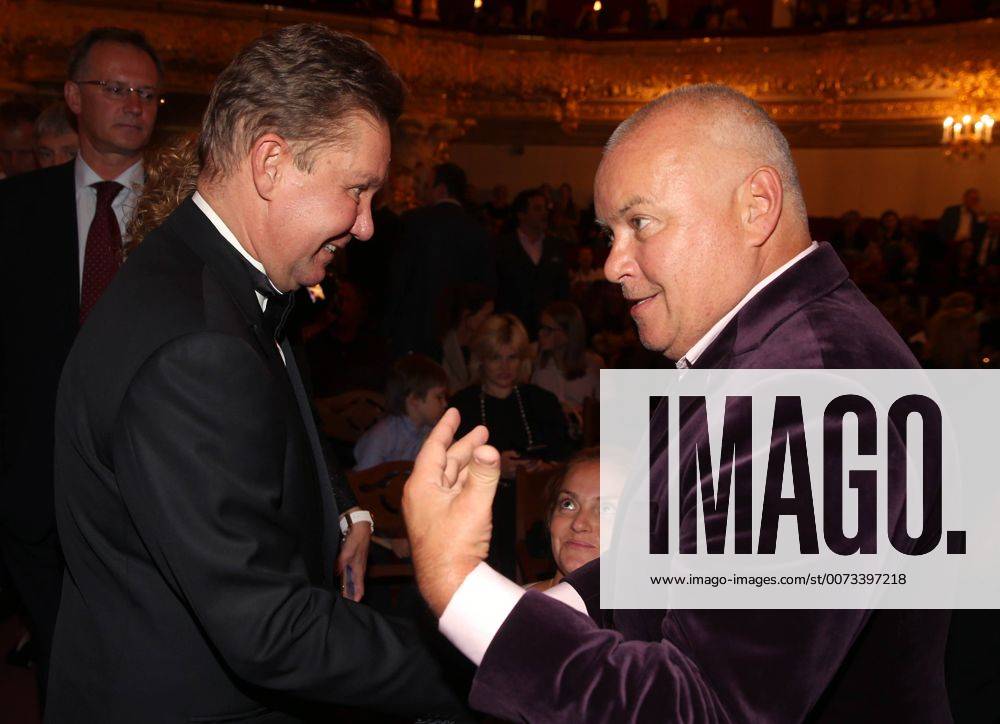 Chairman of the board of directors at Gazprom, Alexei Miller (L) and journalist Dmitry Kiselev shake hands at Moscow s Bolshoi Theatre before a production of Giuseppe Verdi s opera Simon Boccanegra presented by the Teatro alla Scala (Milan s grand opera house) as part of the 2016 Chereshnevy Les Open Art Festival. Artyom Korotayev TASS TS03116F